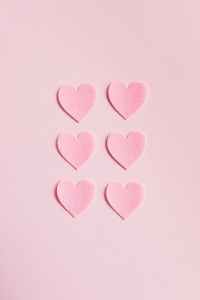 heart shaped cutouts on pink background relationship styles