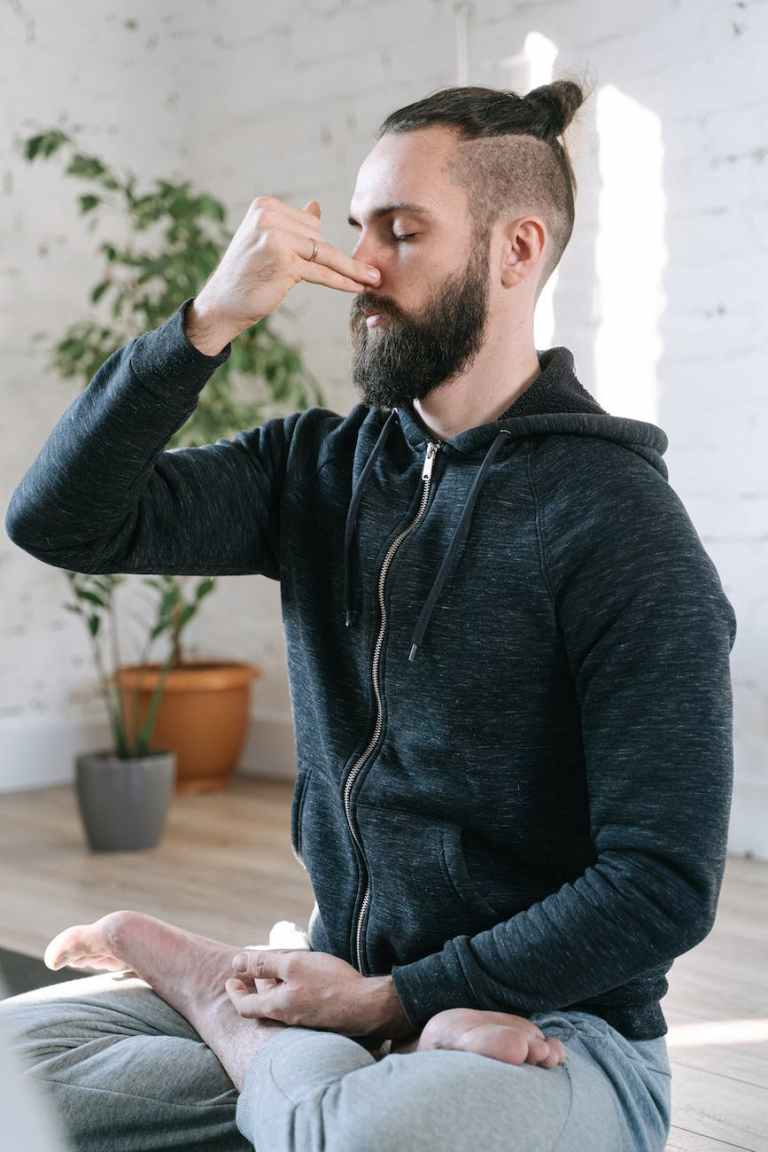 A man meditating practicing breathing control