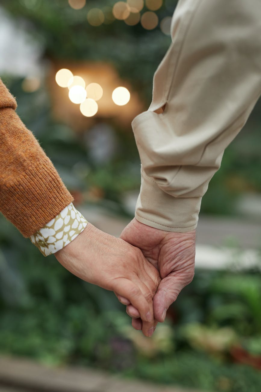 Close up view of couple holding hands thriving relationship