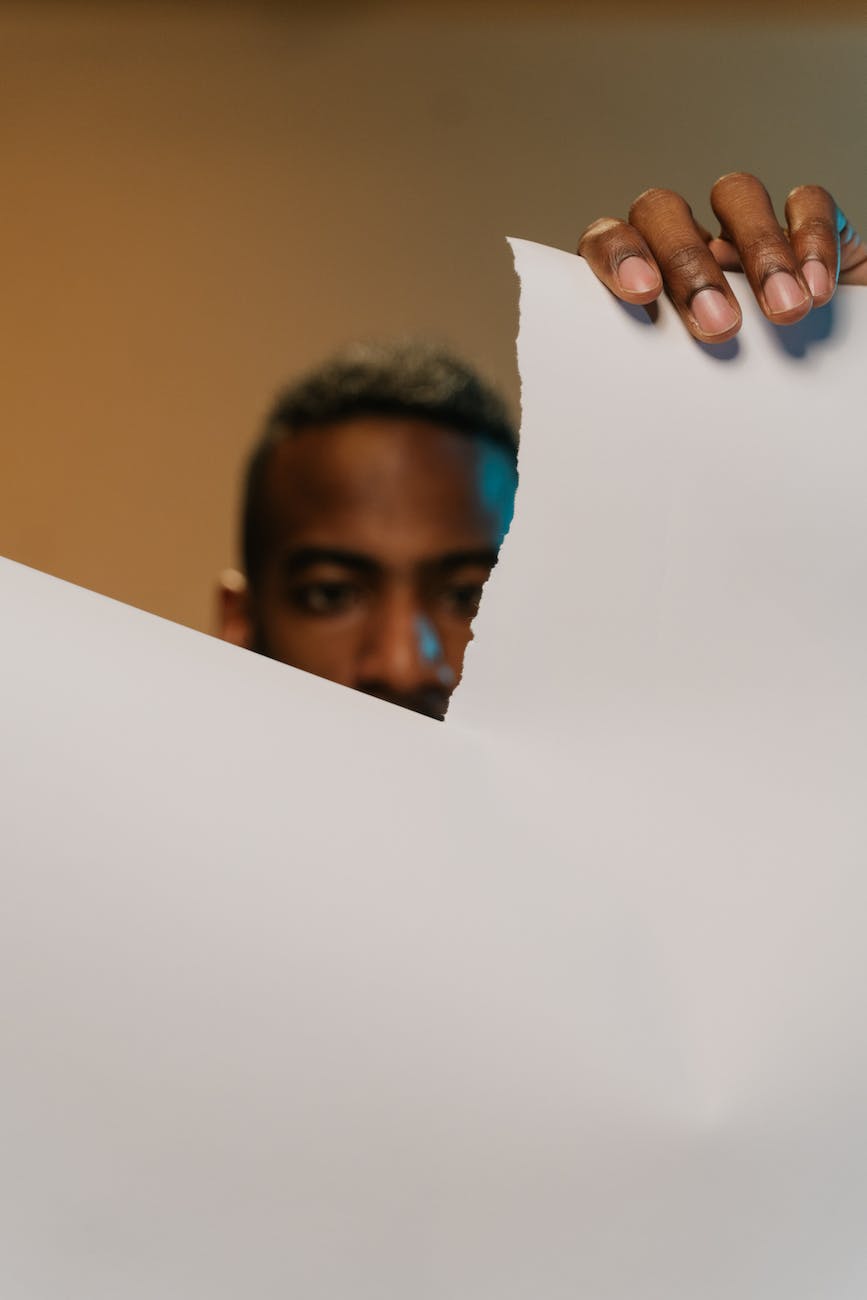 A man tearing a sheet of paper anger