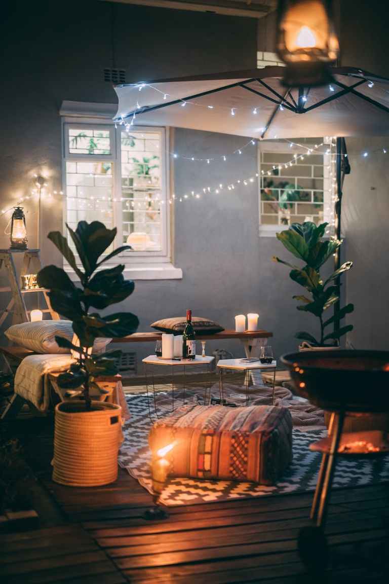 Photo of string lights on umbrella fun date night ideas at home