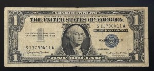 $1 bill featuring a Blue Seal Silver Certificates from 1957 series.