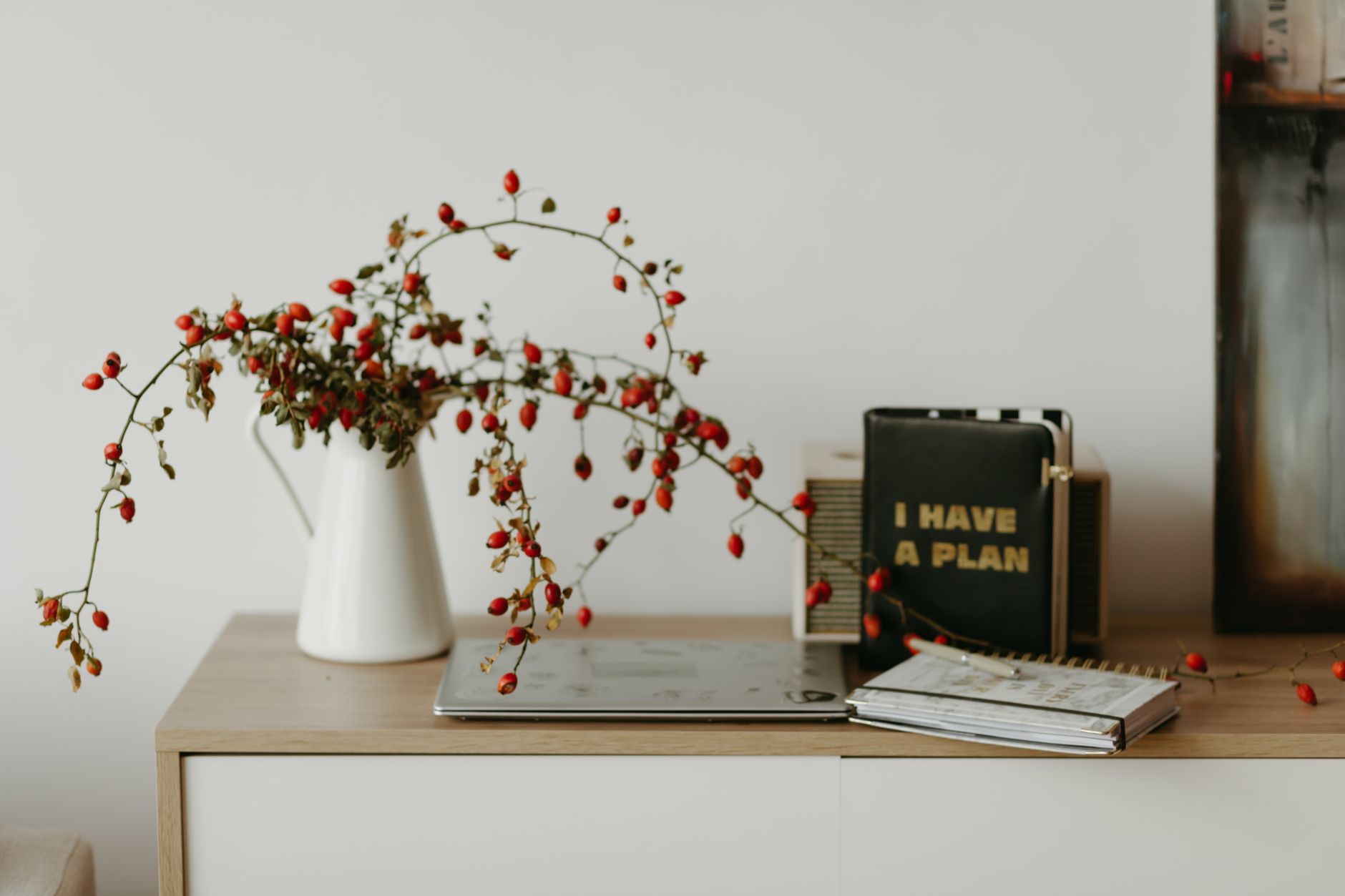 DIY Wedding Planning Tools featured image: wedding planning binder checklist laptop flowers